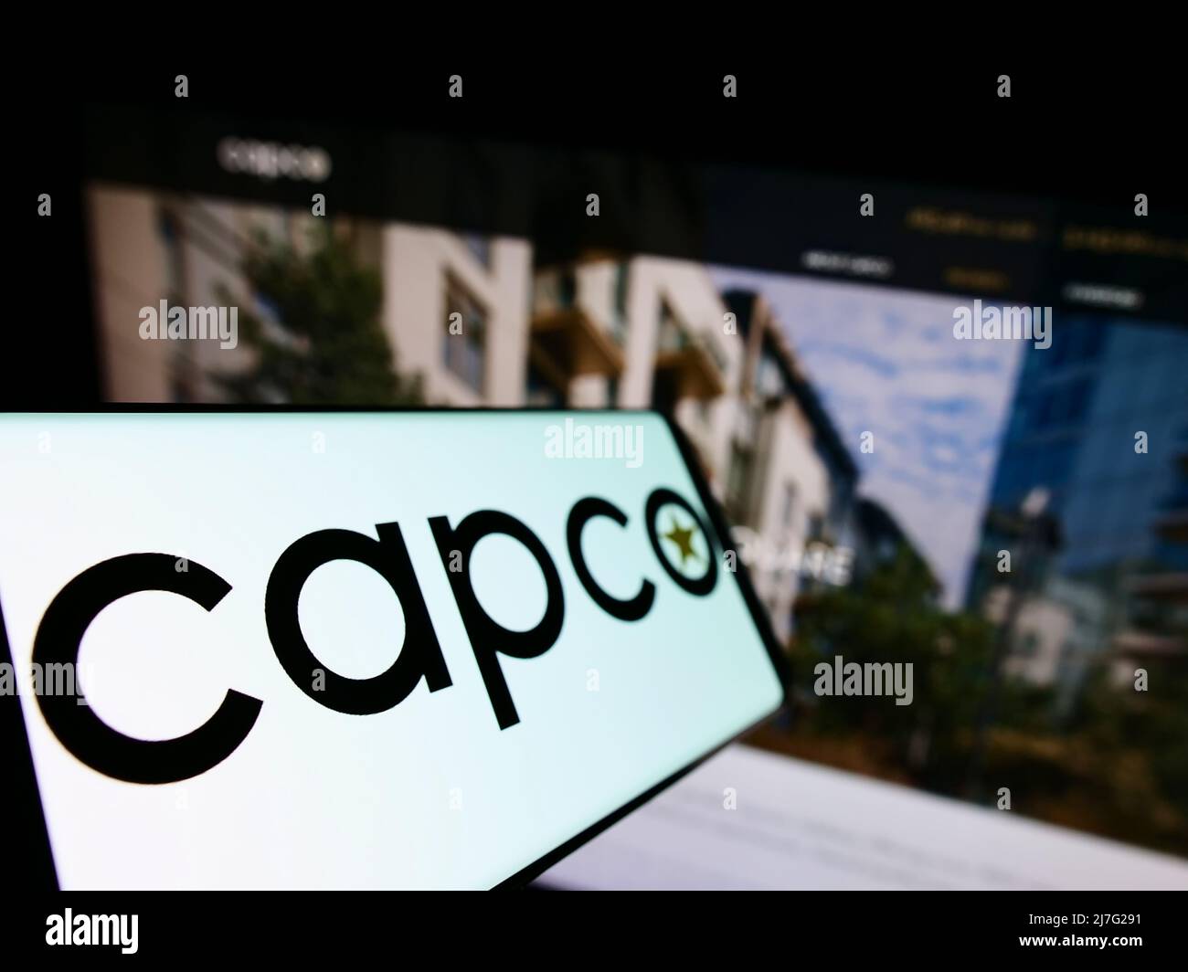 Smartphone with logo of company Capital Counties Properties plc (Capco) on screen in front of business website. Focus on left of phone display. Stock Photo