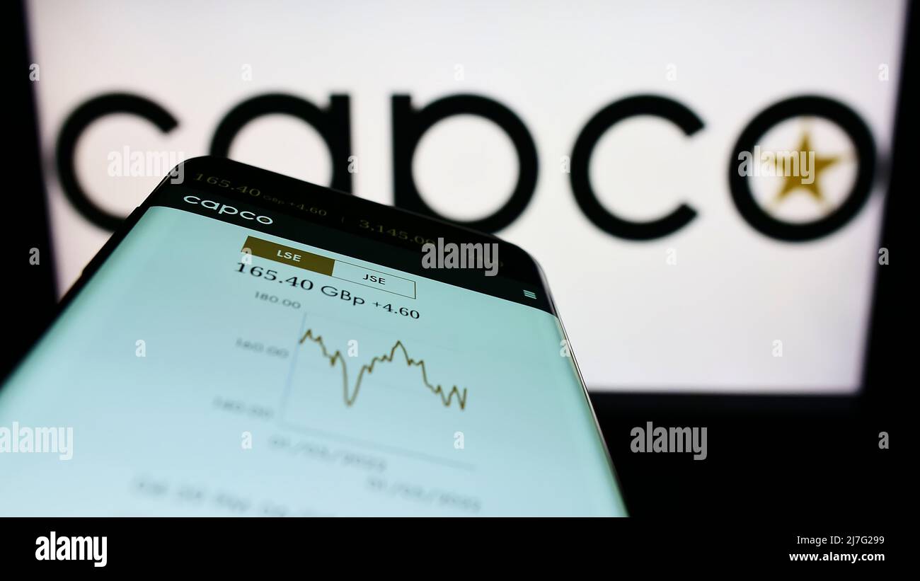 Mobile phone with website of company Capital and Counties Properties plc (Capco) on screen in front of logo. Focus on top-left of phone display. Stock Photo