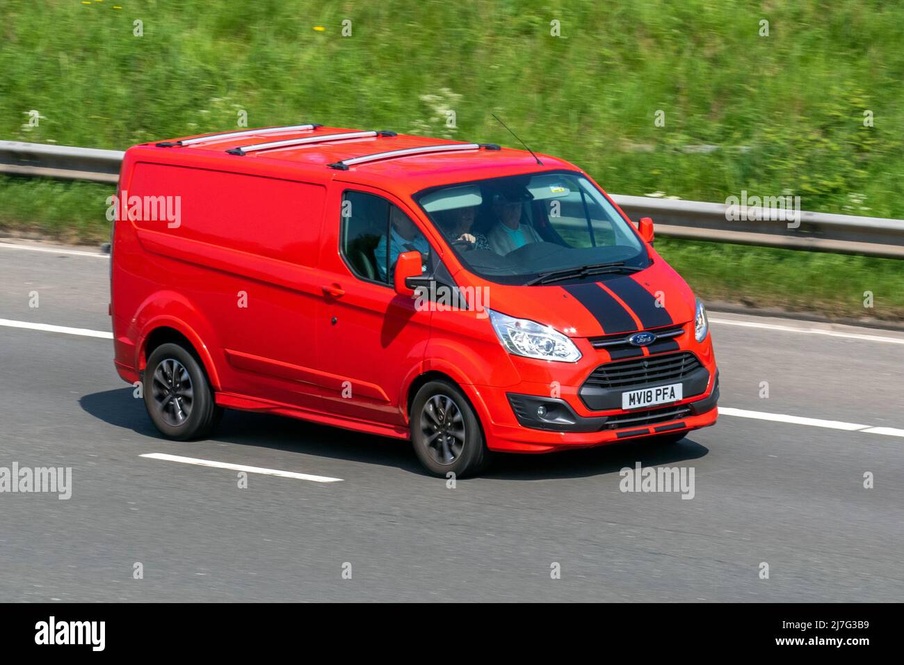 2028 red Ford Transit Custom 290 Limited 1995cc diesel 6 speed manual;  driving on the M61 Motorway, Manchester, UK Stock Photo - Alamy