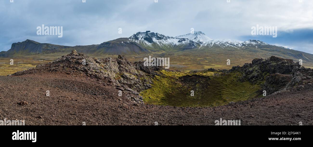 Spectacular volcanic view from Saxholl Crater, Snaefellsnes peninsula, West Iceland. Snaefellsjokull snowy volcano top in far. Stock Photo