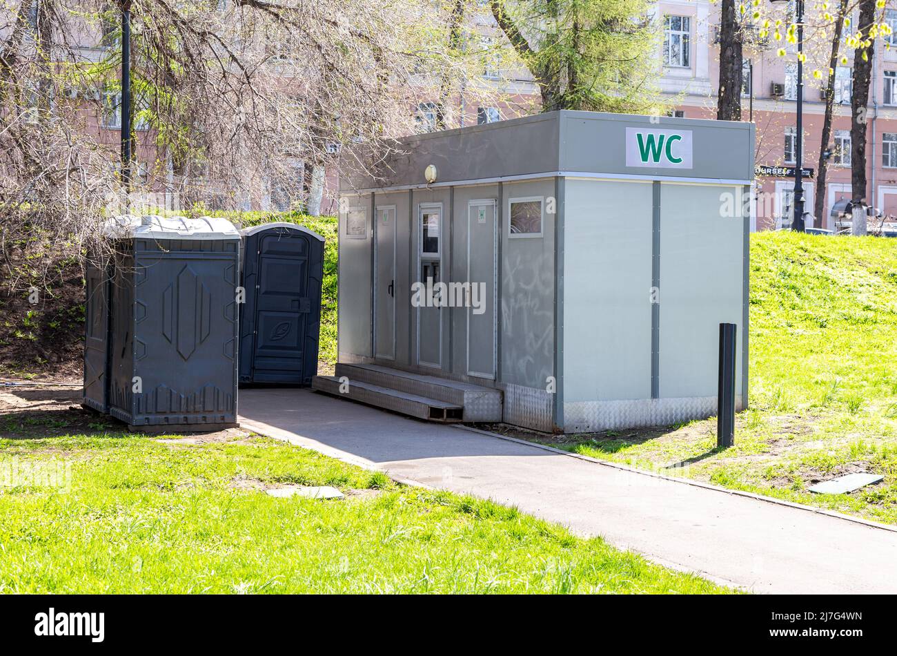 Samara, Russia - May 3, 2022: Public toilets at the city park in summer sun...