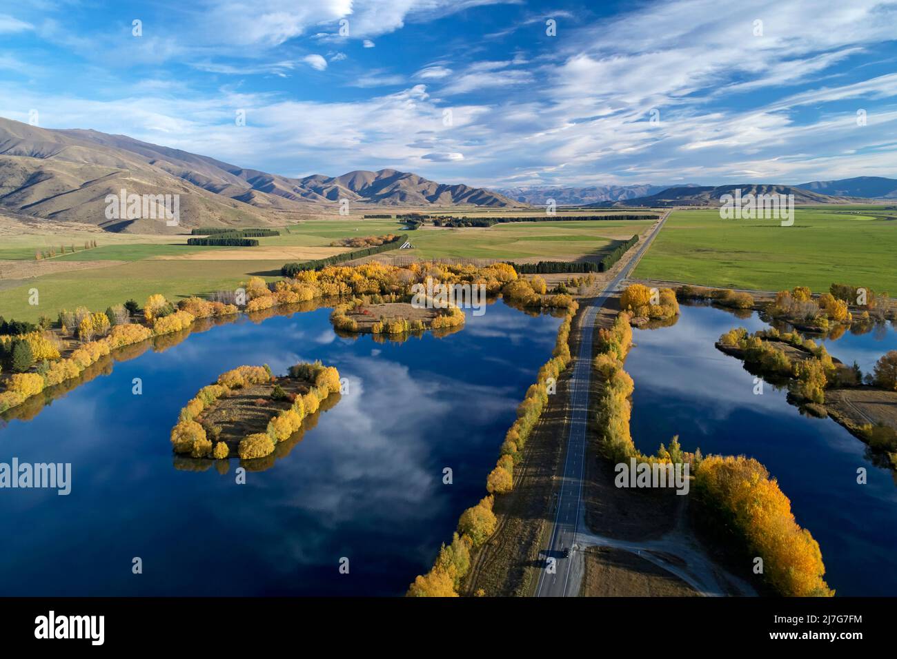Wairepo Arm (left), State Highway 8, and Kellands Pond (right), Twizel, Mackenzie District, North Otago, South Island, New Zealand - drone aerial Stock Photo