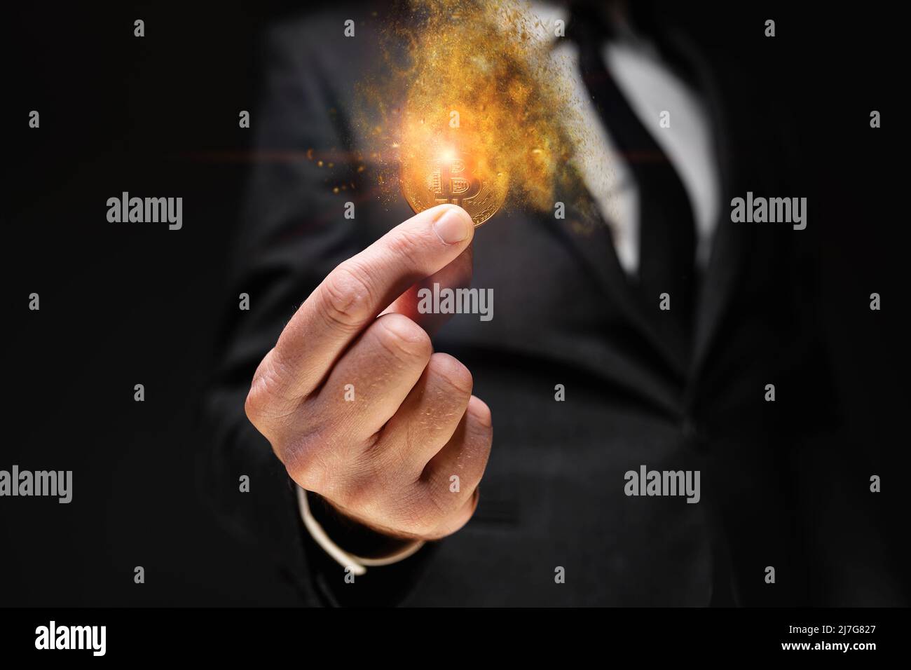 Bitcoin cryptocurrency value drop, investor holding crypto currency dissolving coin in hand, selective focus Stock Photo