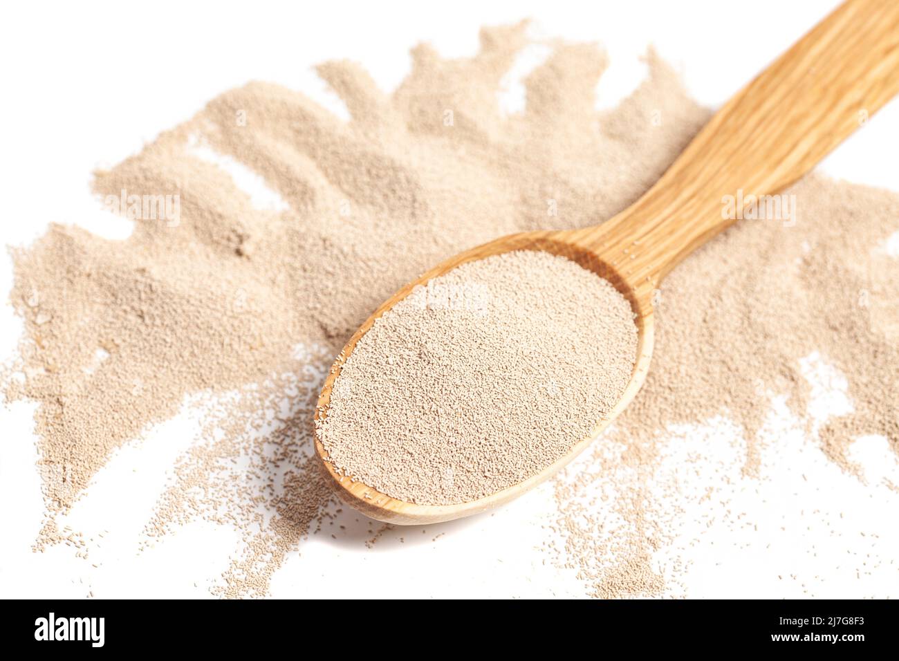 Active dry baking yeast granules in wooden spoon Stock Photo Alamy