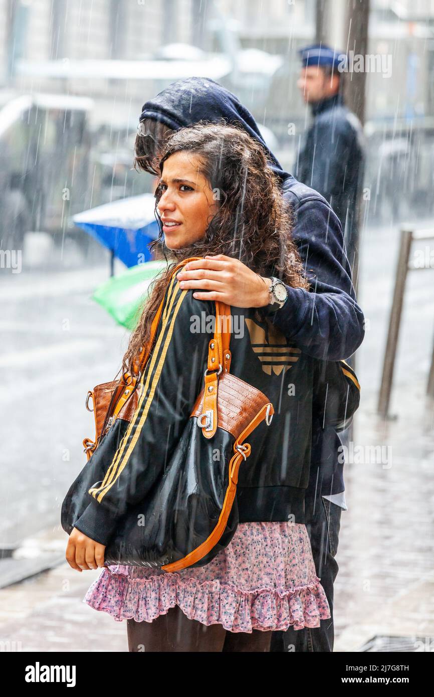 Young couple in the rain. Brussels. Stock Photo