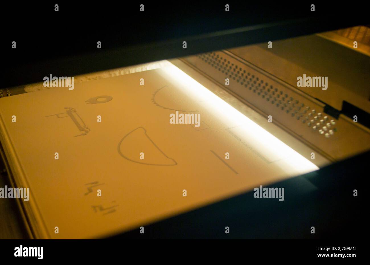 Powder 3D printer printing models from white powder polyamide closeup