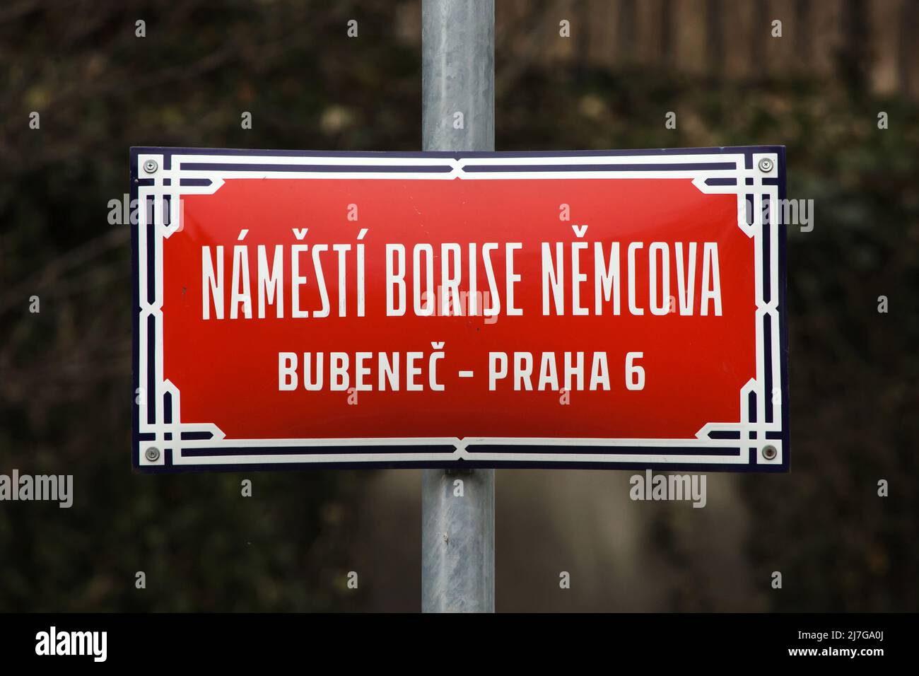 Náměstí Borise Němcova (Boris Nemtsov Square). Traditional red street sign next to the building of the Russian Embassy in Bubeneč district in Prague, Czech Republic. In February 2020, the square formerly known as Pod Kaštany Square was named after Russian liberal politician Boris Nemtsov (Boris Němcov) killed in February 2015. Stock Photo