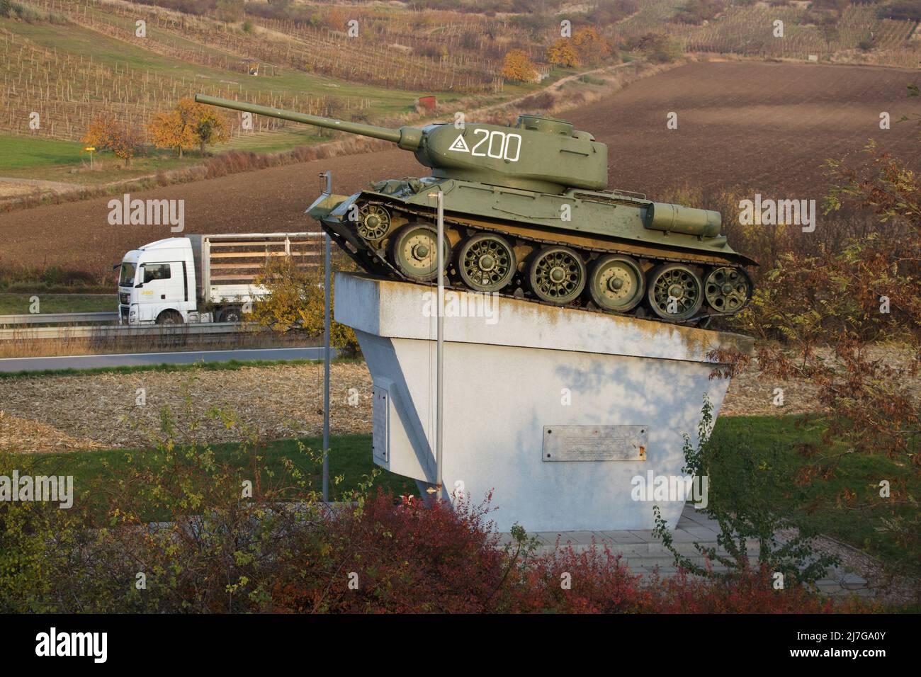 Soviet T-34 tank installed on the pedestal next to the village of Starovičky in South Moravia, Czech Republic. The monument was erected in 1975 on the place where an important tank battle between the armoured troops of the 2nd Ukrainian Front of the Red Army and the Wehrmacht took place on 16 April 1945. During this battle, the Soviet T-34-85 medium tank number 200 under command of junior lieutenant Ivan Mirenkov broke through behind enemy lines and destroyed three German tanks. Stock Photo