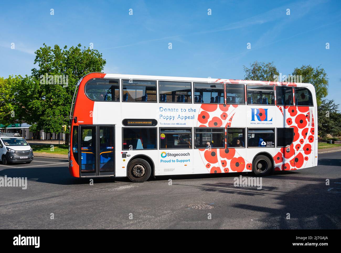 700 Coastliner Stagecoach bus painted in red & white livery with poppies to show support for 'Proud to donate' poppy appeal, Royal British Legion, UK. Stock Photo