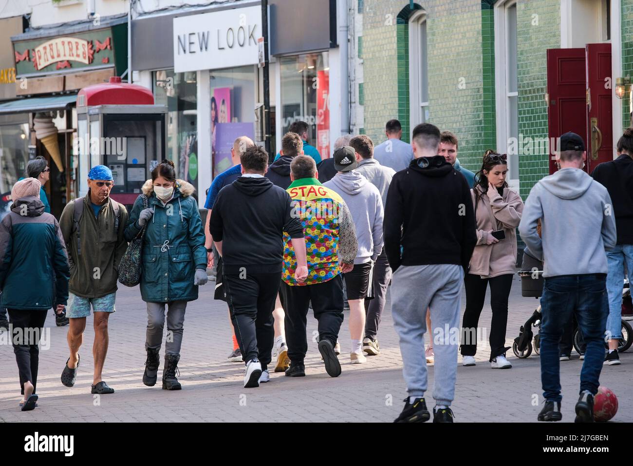 A group of lads on a stag weekend walking through Newquay Town centre in Cornwall in the UK. Stock Photo