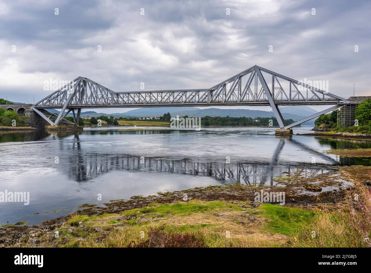 Connel Bridge is a cantilever bridge linking the villages of Connel and North Connel at the sea-mouth of Loch Etive in Argyll and Bute in Scotland, UK Stock Photo