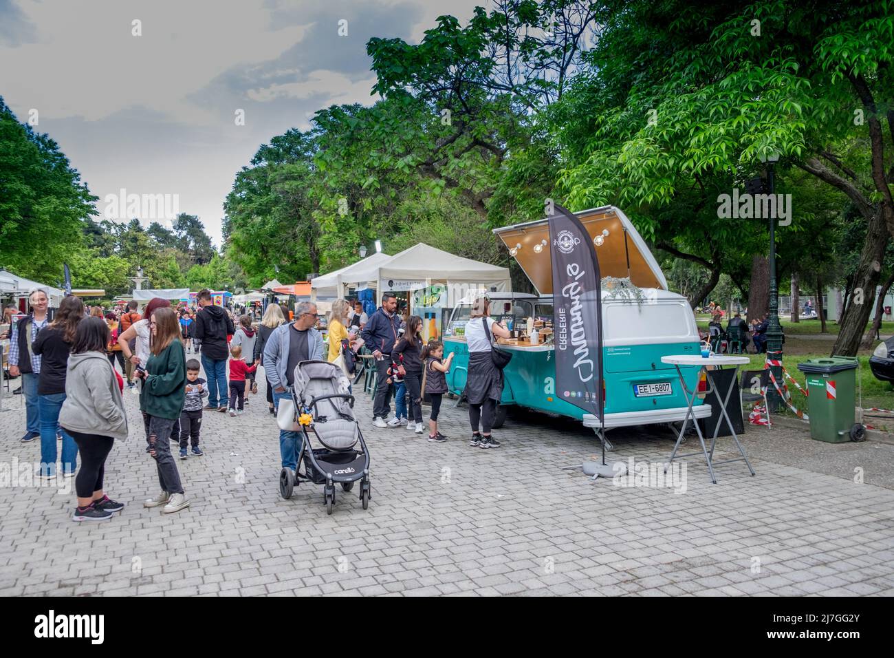 People walking and ordering in the food vans on the Dinosaur Festival in  Katerini city , Greece Stock Photo - Alamy