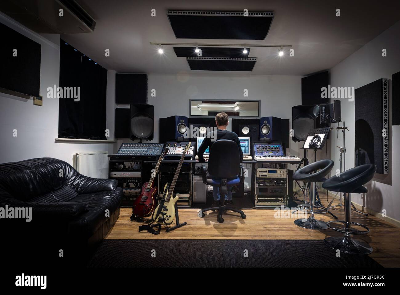 Recording Studio Control Room with an engineer producer sitting at the