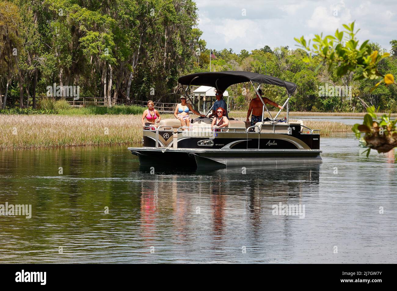 5 adults on pontoon boat, 3 women, 2 men, recreation, leisure