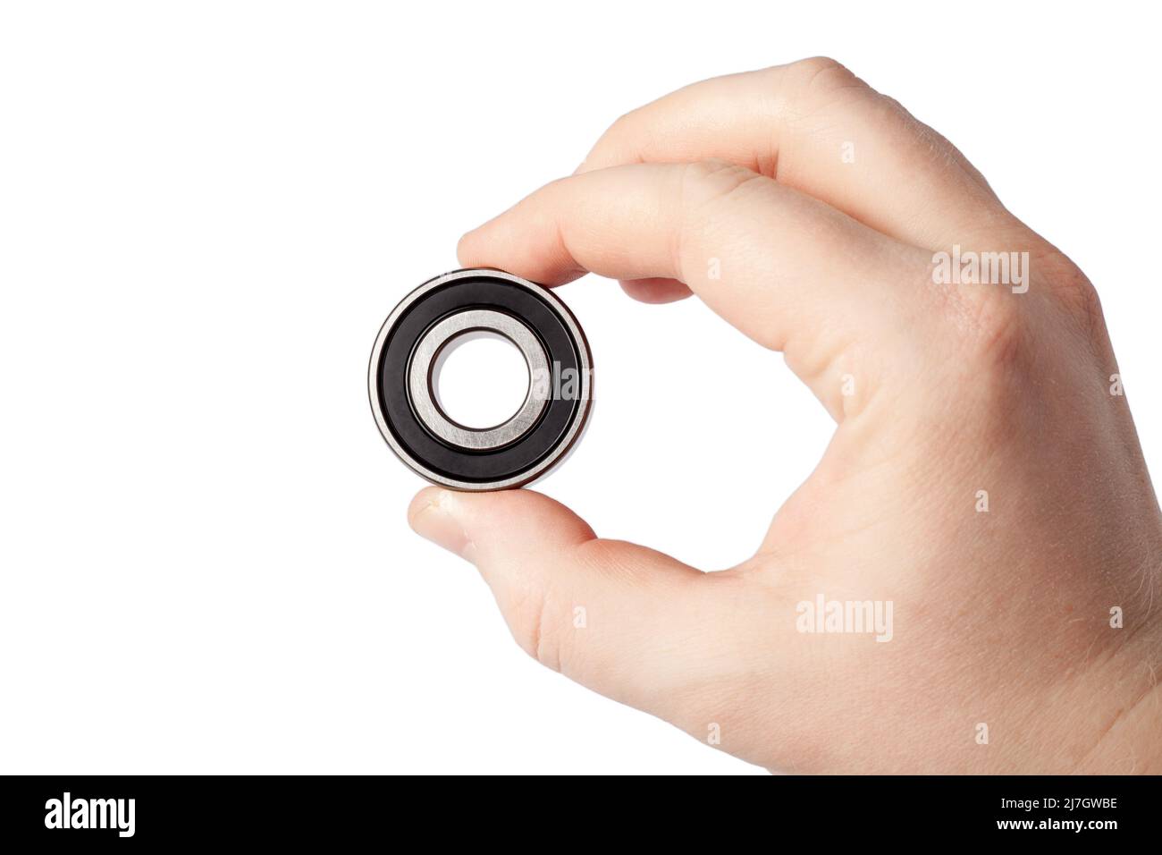 Ball bearing isolated. Male hand holding metal roller bearing. Super Precision Ball Bearings
