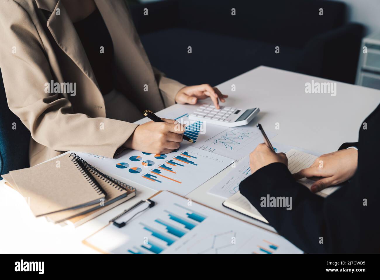 Business People Meeting to analyse and discuss and brainstorming the financial report chart data in office Financial advisor teamwork and accounting Stock Photo