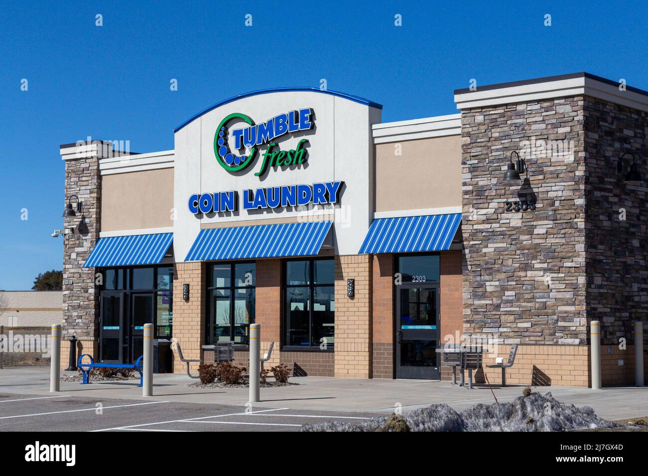 HUDSON, WI,USA - MARCH 26, 2022: Tumble Fresh Laundromat exterior and trademark logo. Stock Photo