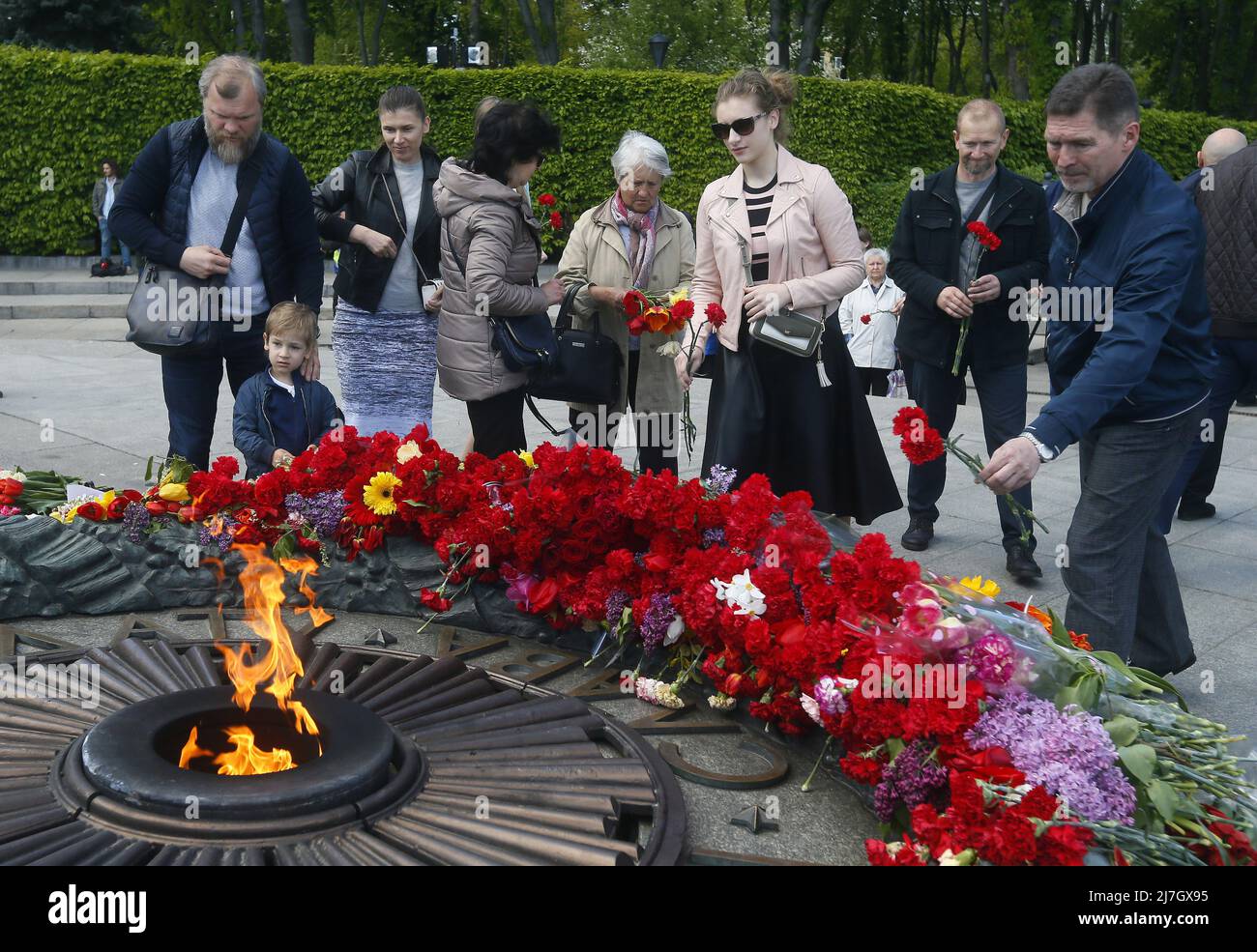 Ukrainians lay flowers at the Tomb of the Unknown Soldier on the 77th ...