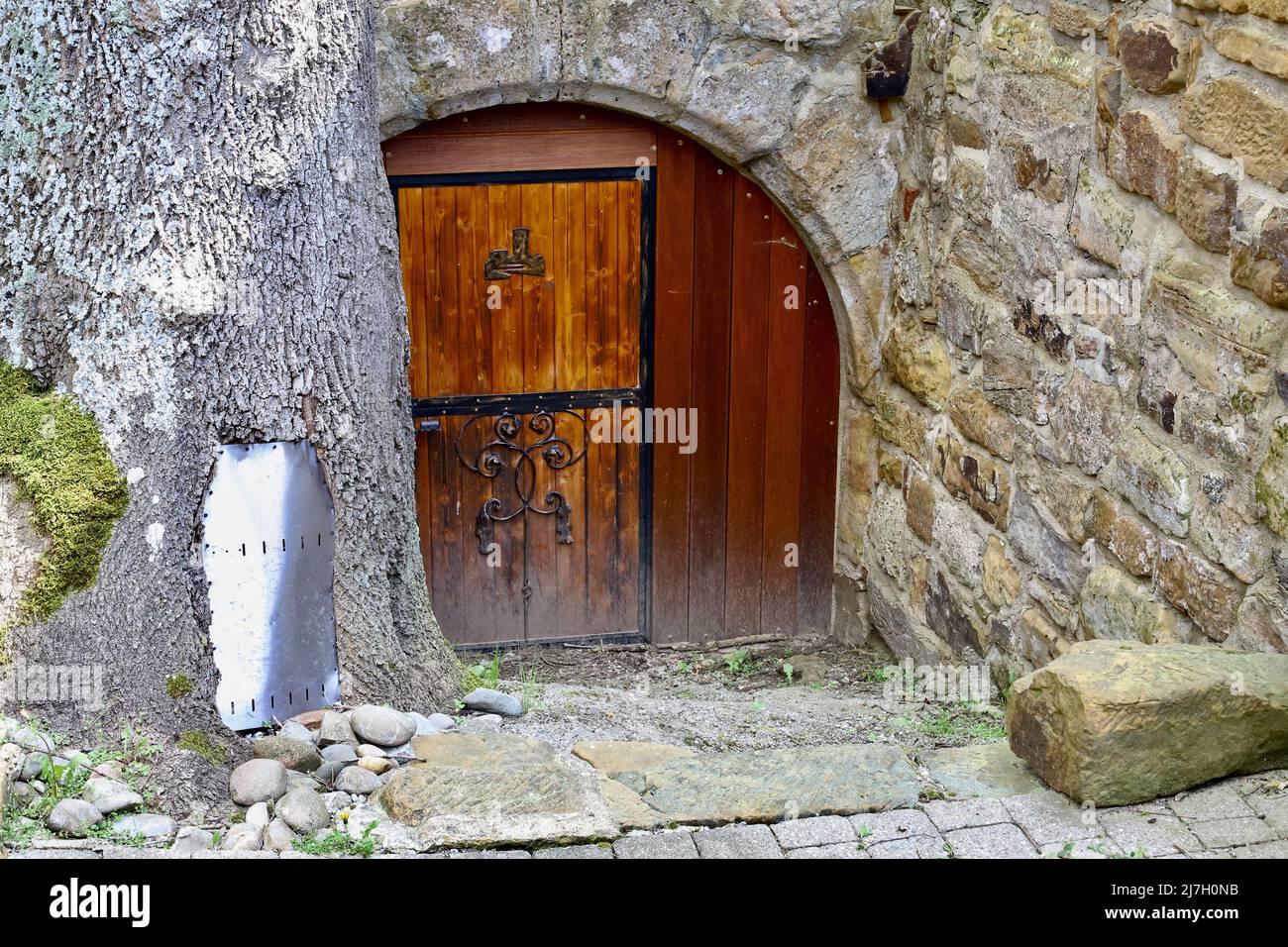old wooden door in a stone wall Stock Photo - Alamy