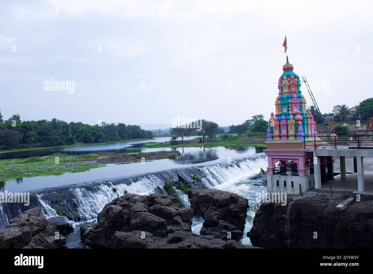 Temple in side of river, stone carving Nandi gram, Temple under tree Stock Photo