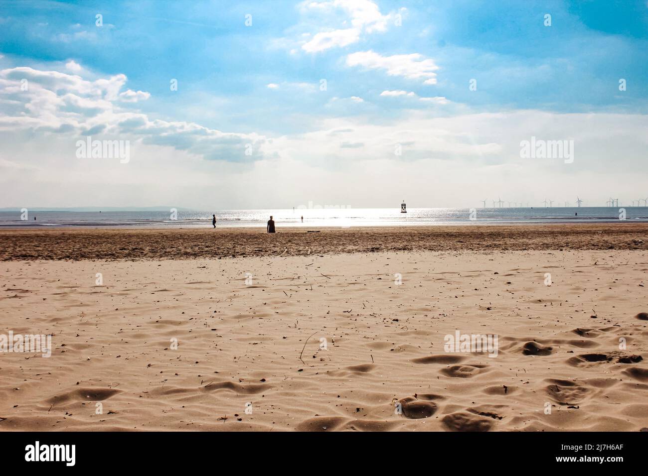 Beautiful views of the sand, ocean and horizon at Crosby Beach, England Stock Photo