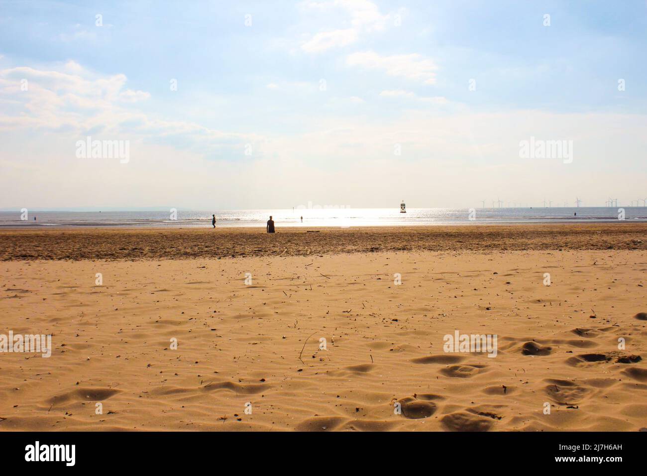 Beautiful views of the sand, ocean and horizon at Crosby Beach, England Stock Photo