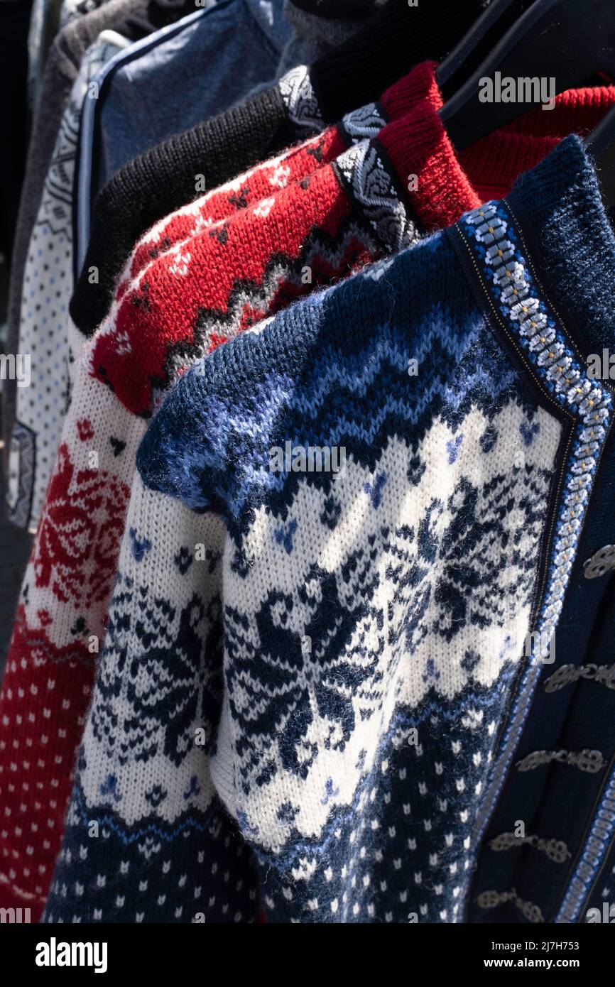 Handmade woolen Scandinavian ladies cardigans, Norwegian style sweater in all kinds of colors and patterns, in an open air market stall Stock Photo