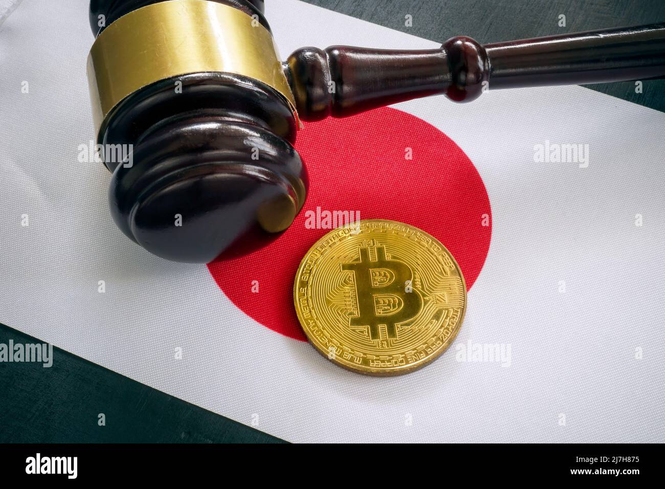 Cryptocurrency regulations in Japan. Flag, gavel and coin. Stock Photo