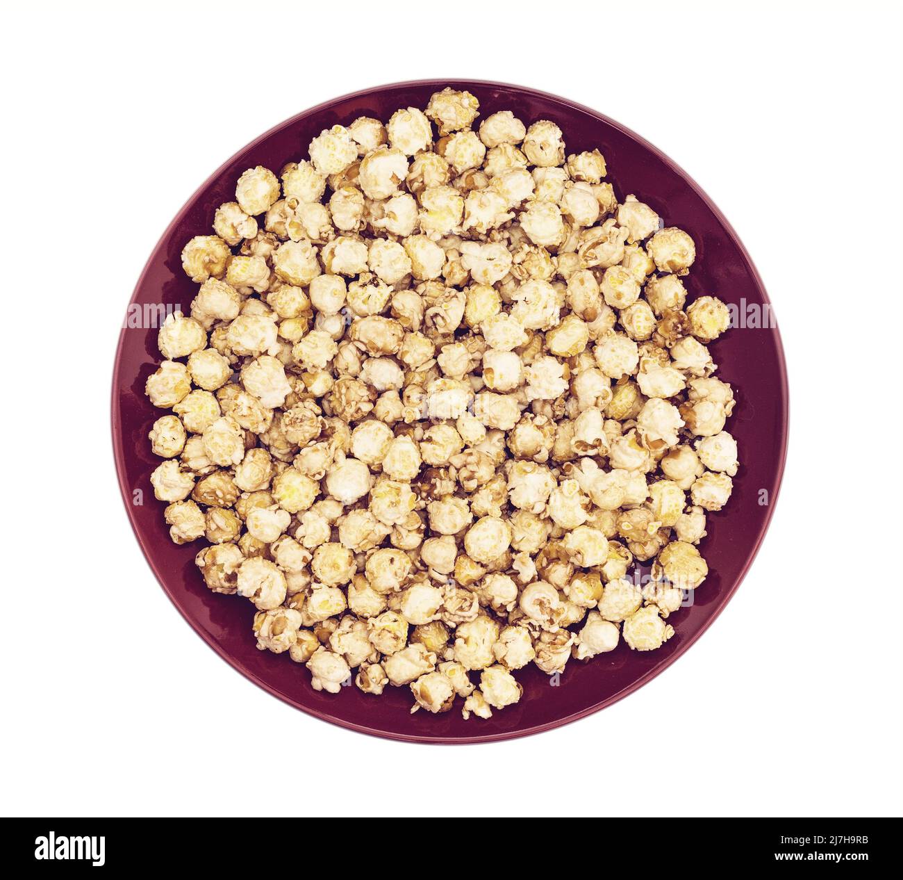 caramel popcorn on dark dish plate Stock Photo