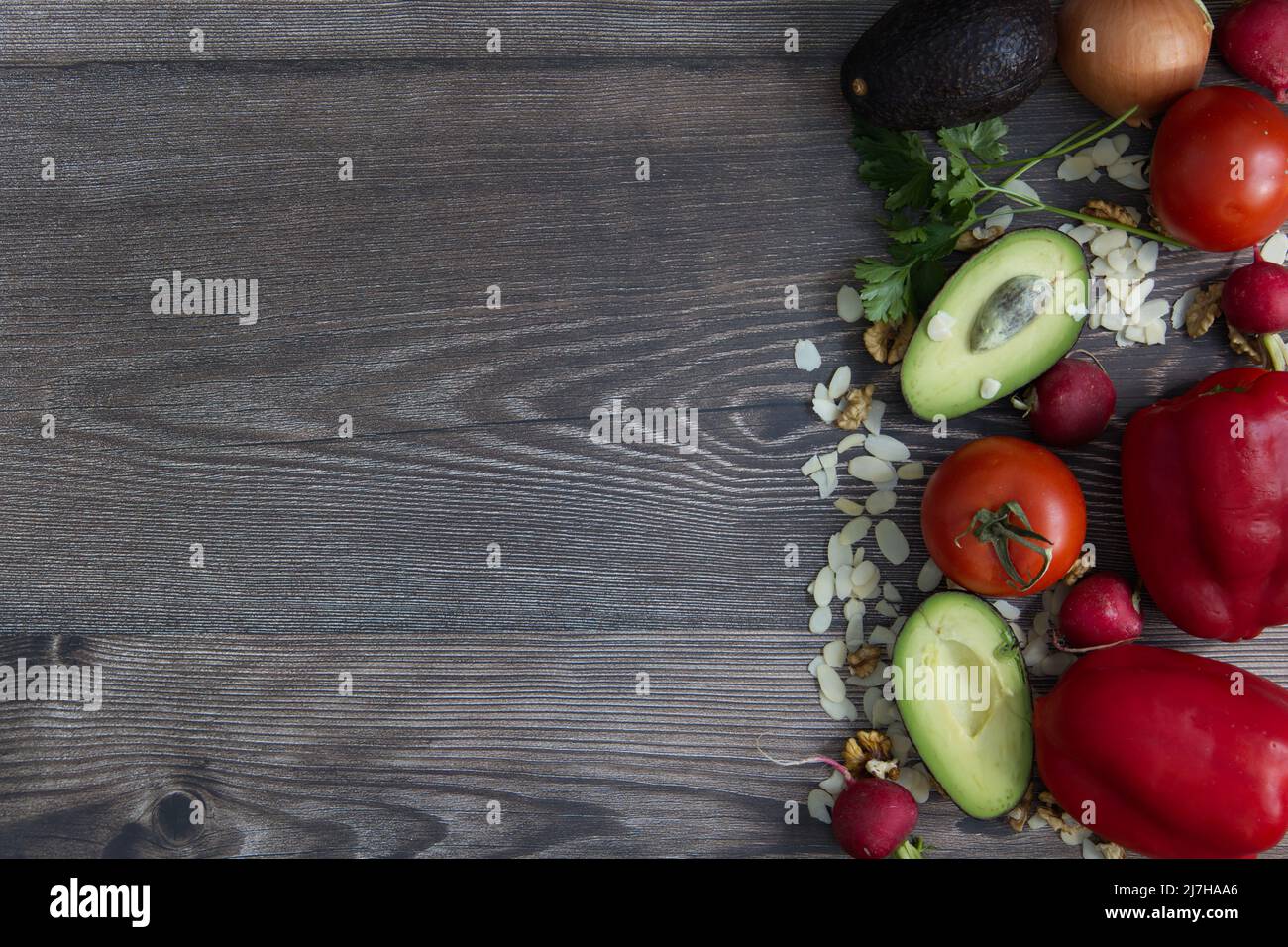 fork, spoon and knife on a wooden table Stock Photo