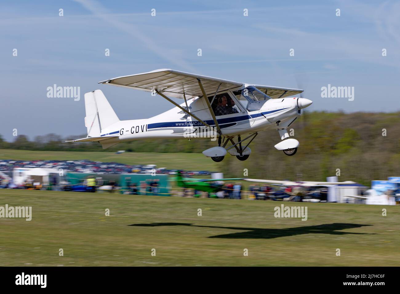 Aerosport Ikarus C42 G-CDVI microlight airplane of Airbourne Aviation takes off from Popham airfield near Basingstoke in Hampshire England Stock Photo