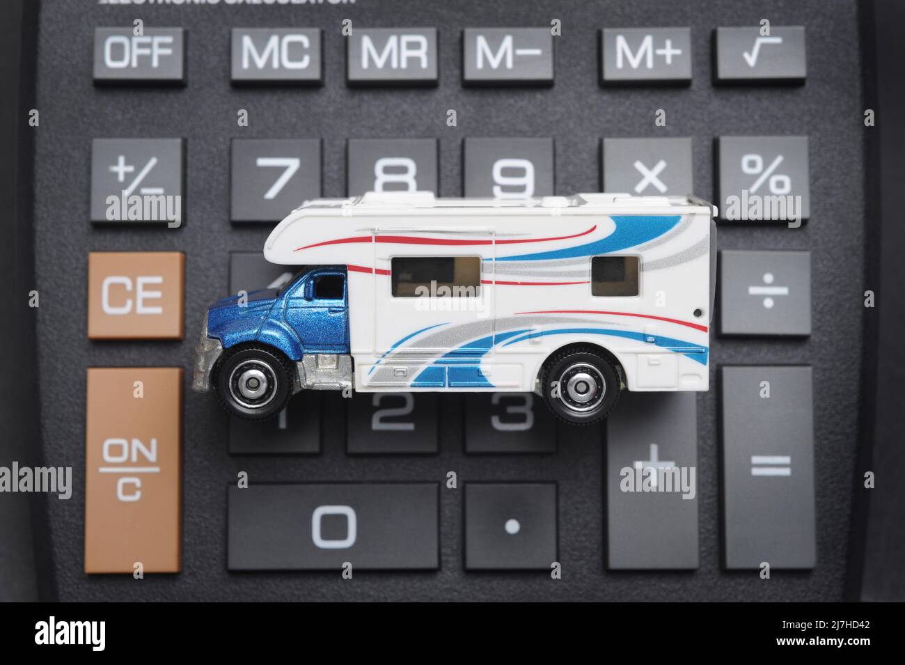 MOTORHOME MODEL ON CALCULATOR RE LEISURE HOLIDAYS COSTS CAMPER VANS RV OWNERSHIP ETC UK Stock Photo