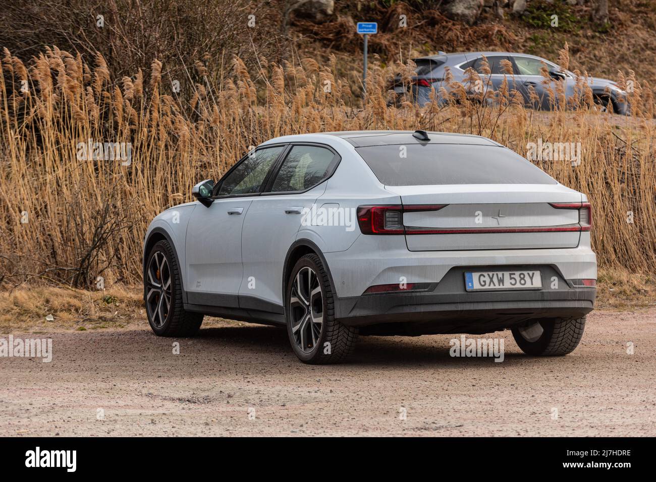 Polestar 2 electric performance car on a gravel parking lot Stock Photo