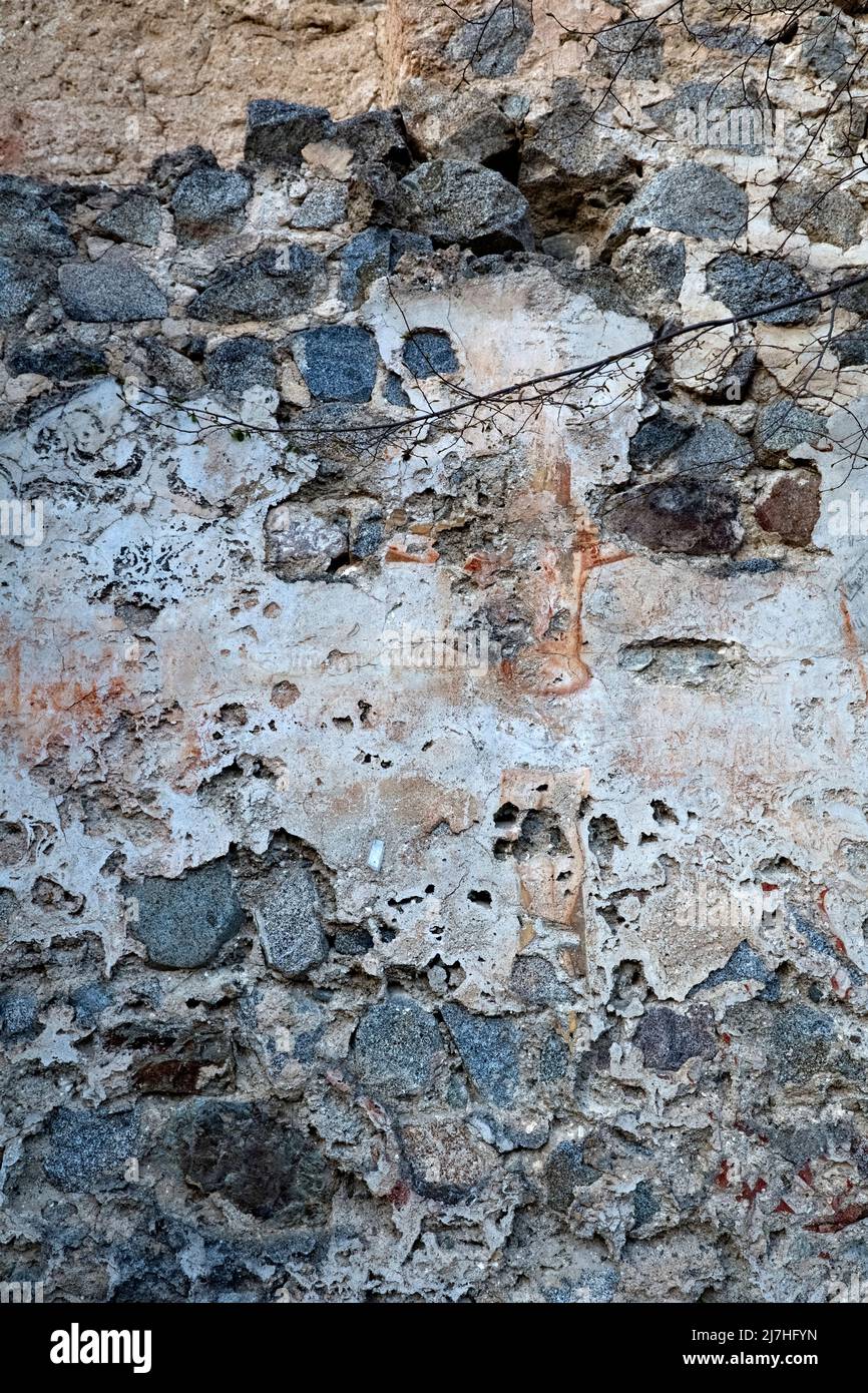 Deteriorated fresco depicting a crucifix in the ruins of the castle of Castellalto. Telve, Trento province, Trentino Alto-Adige, Italy. Stock Photo