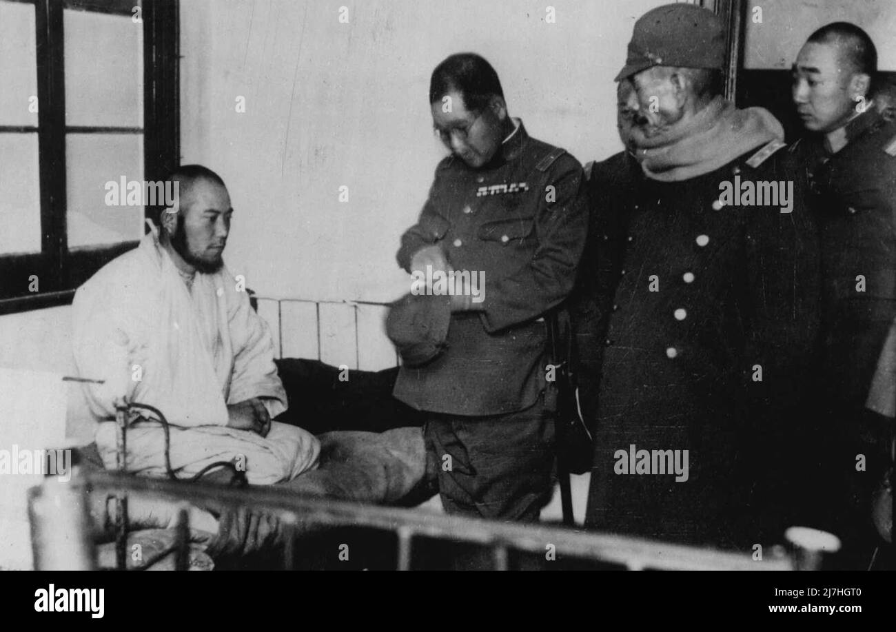 C-In-C Japan's Forces In Central ***** Visits ***** Soldiers -- General Iwane Matsui, the Commander-in-Chief of the forces in Central China, photographed (right) wearing ***** knitted by the Empress of Japan, chatting to a Japanese soldier when he visited the hospital in ***** by staff officers. February 15, 1938. (Photo by Keystone). Stock Photo