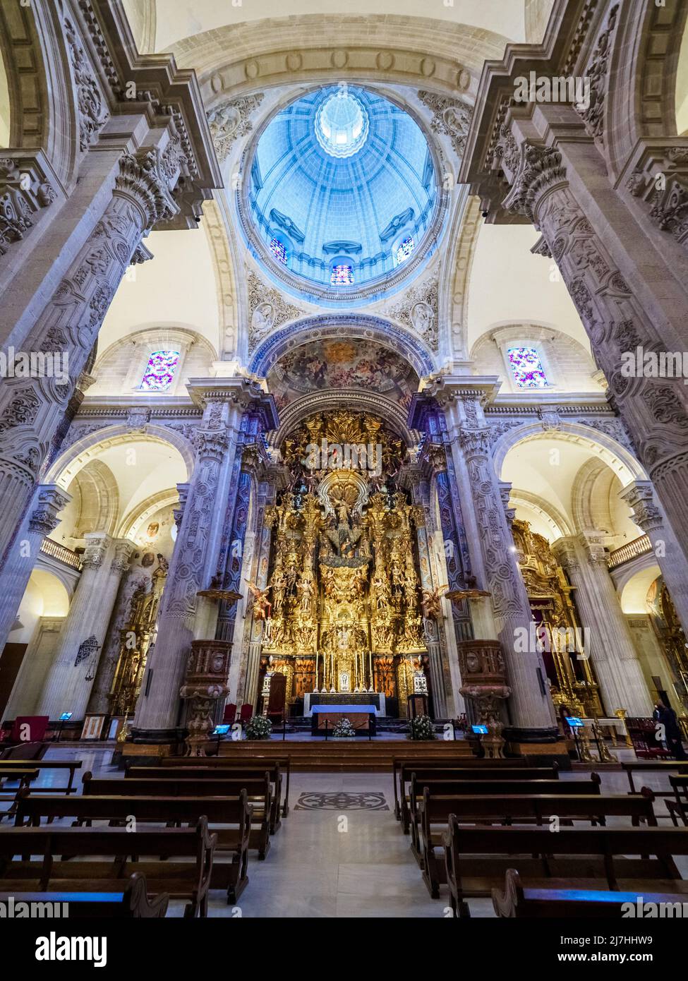 Central nave and the main altarpiece of the Collegiate Church of the Divine Savior - Seville, Spain Stock Photo