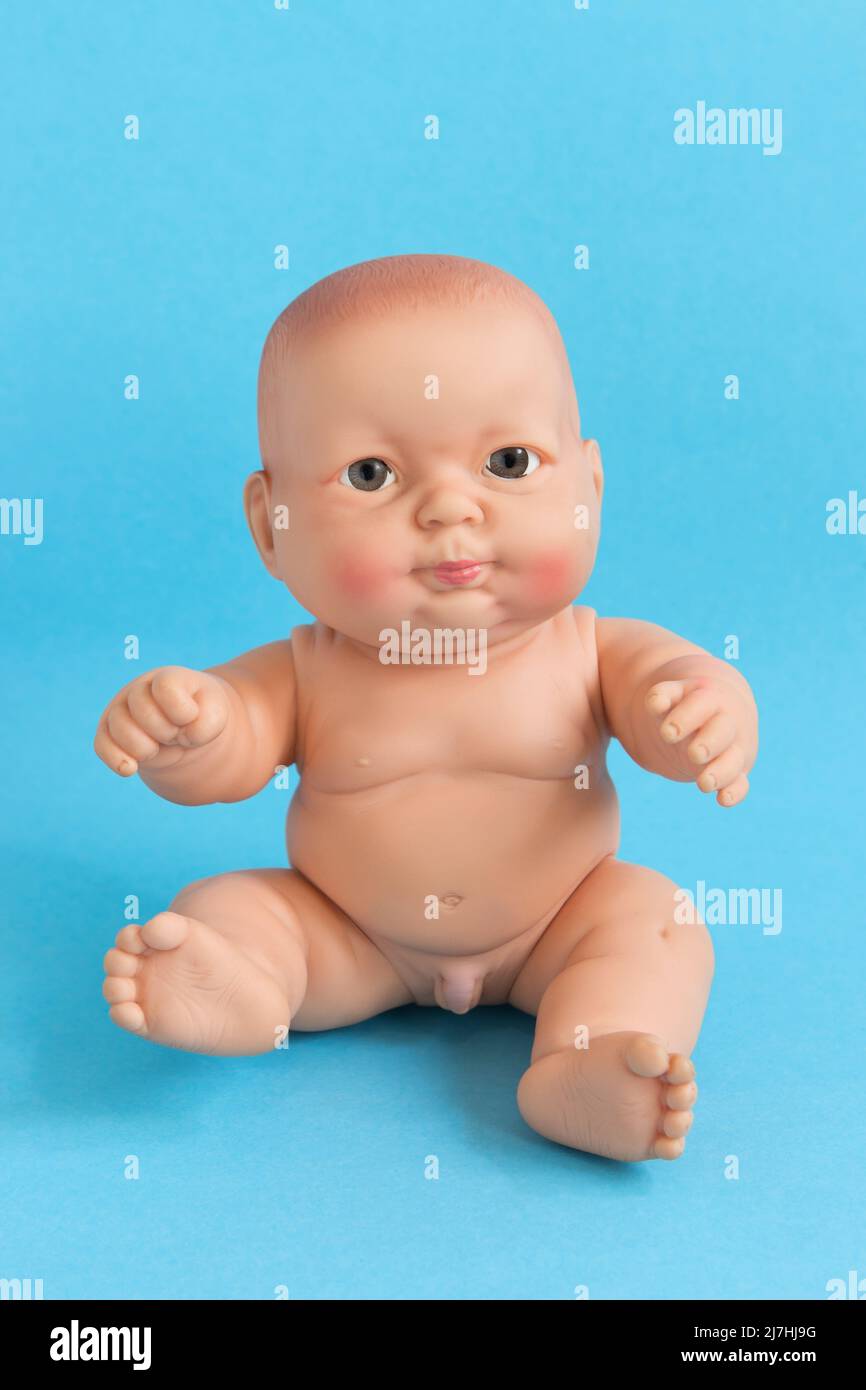 Full Reborn newborn baby doll boy on blue background Stock Photo