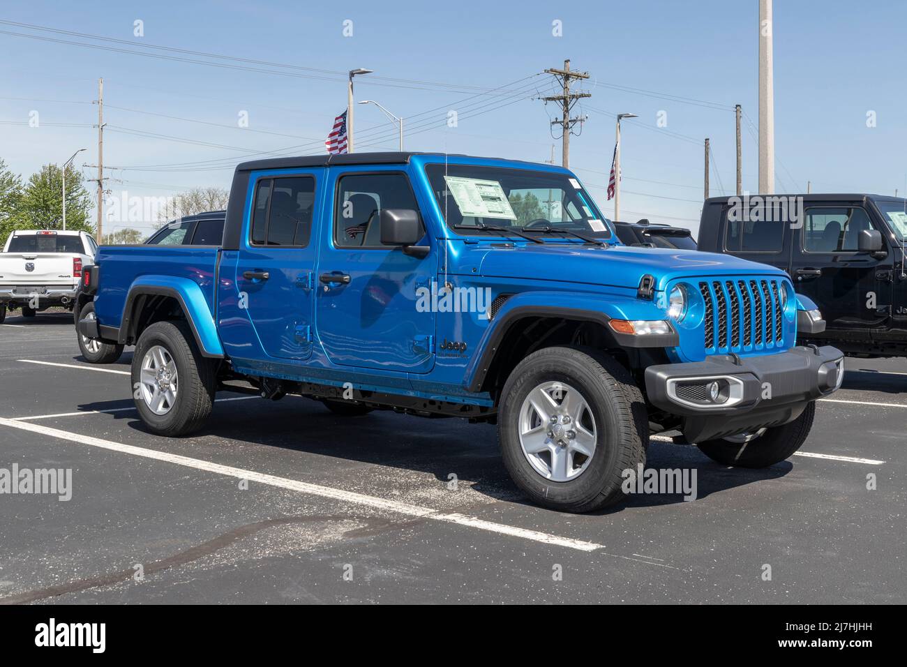 Noblesville - Circa May 2022: Jeep Gladiator display at a Stellantis dealer. The Jeep Gladiator models include the Sport, Willys, Rubicon and Mojave. Stock Photo