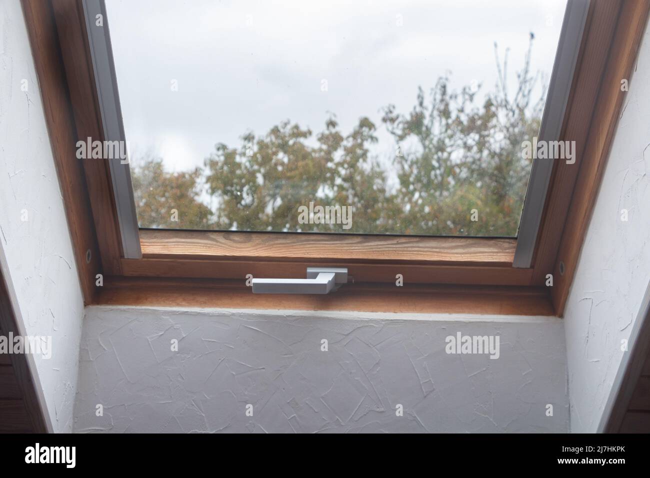 Closed skylight in the roof of an house Stock Photo