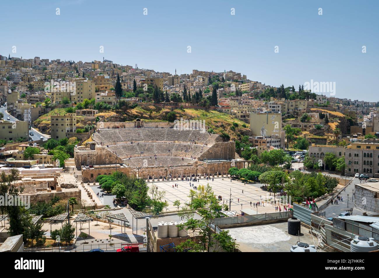 Amman downtown skyline in Jordan dominated by ancient Roman theater structure among residential houses in the old city center Stock Photo