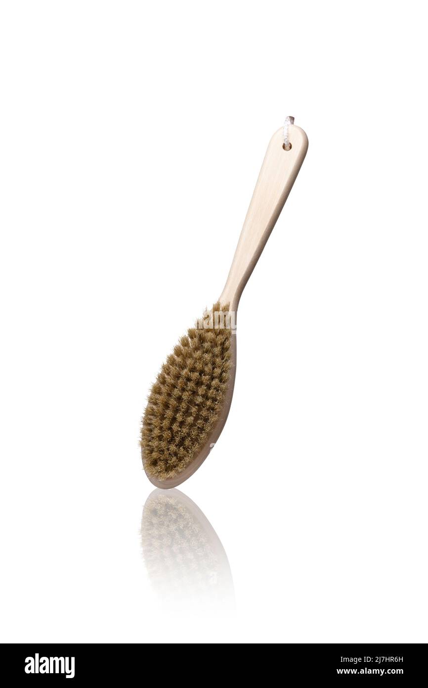 Dry anti cellulite massage brush made of natural materials isolated on white background Stock Photo