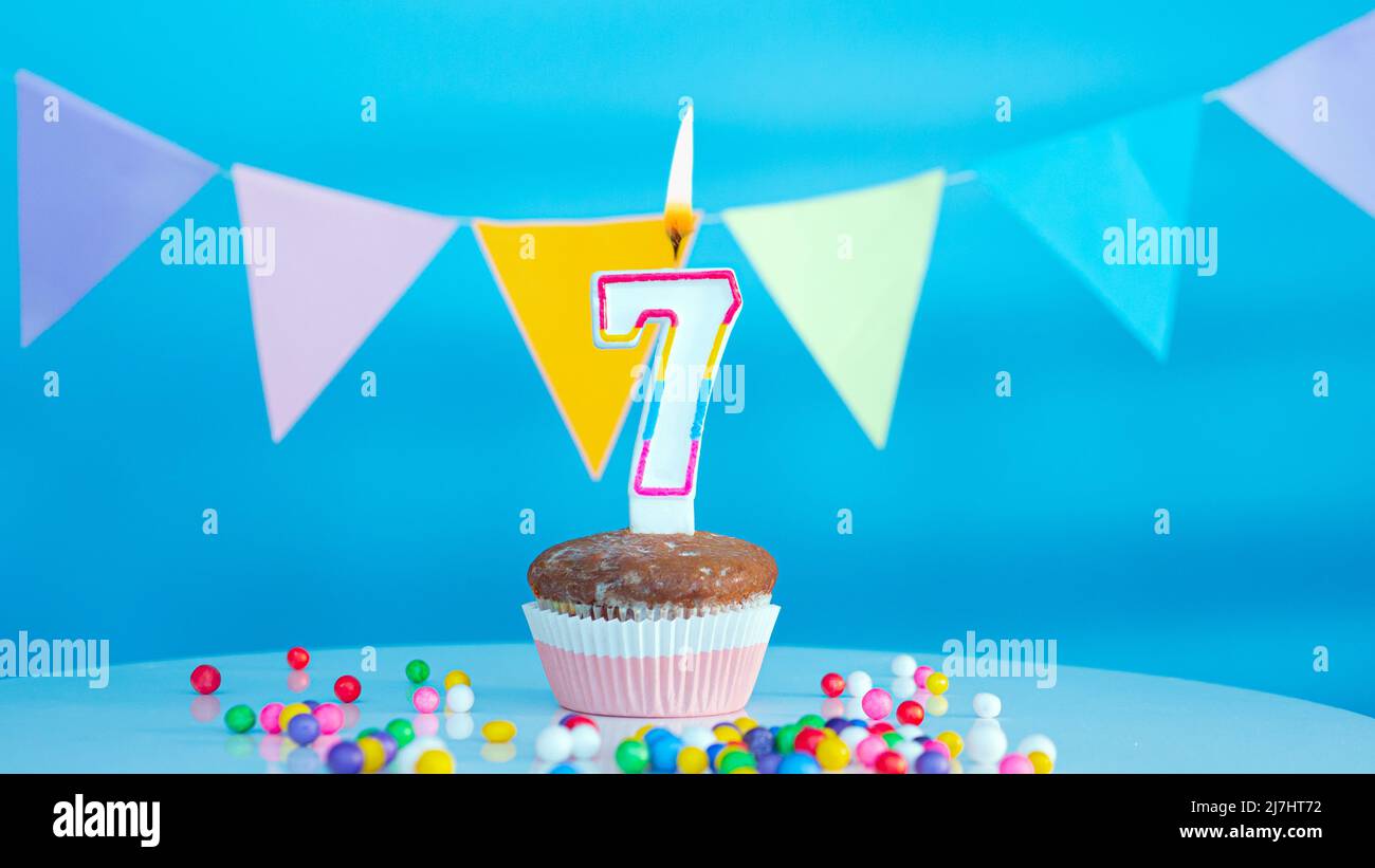 Happy birthday candle letters with a number or digit on a beautiful