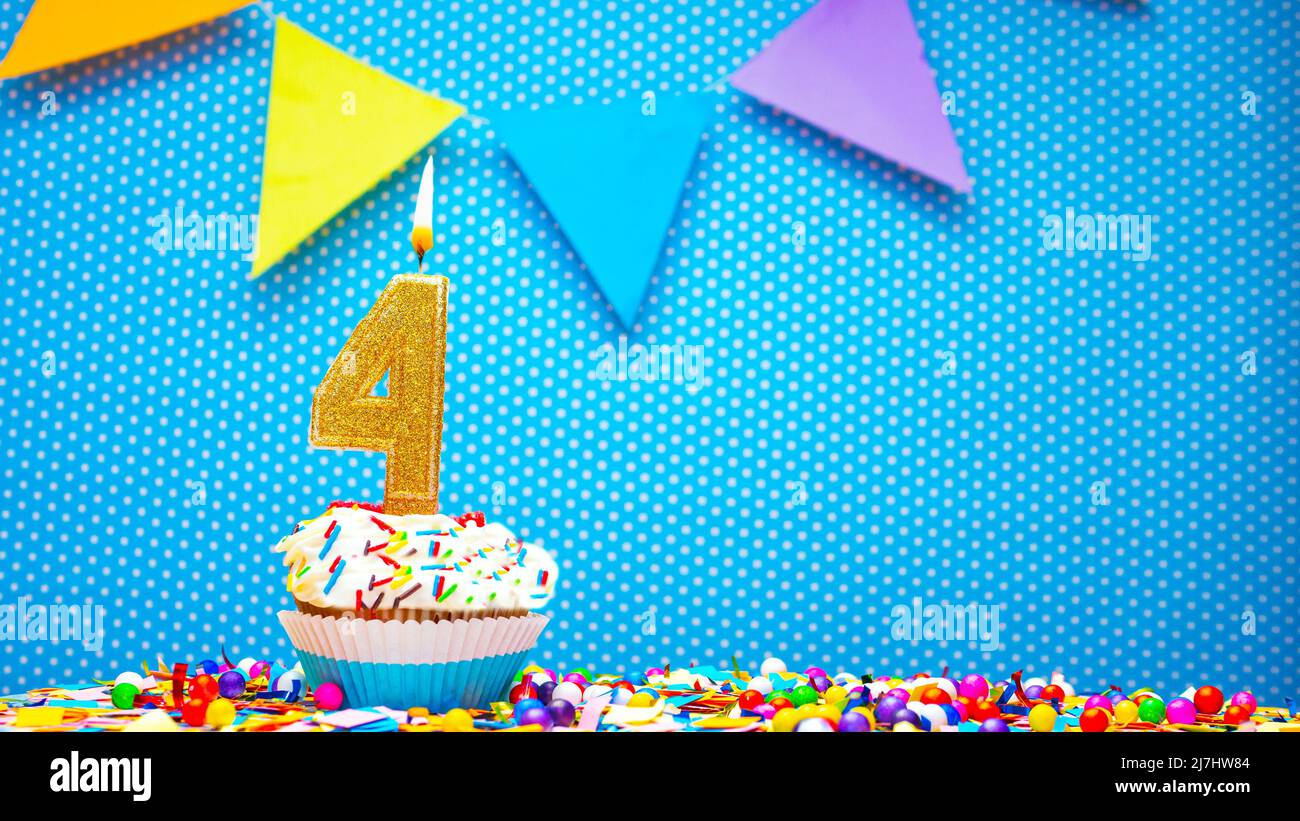 Cream cupcake with birthday candle, colorful happy birthday card