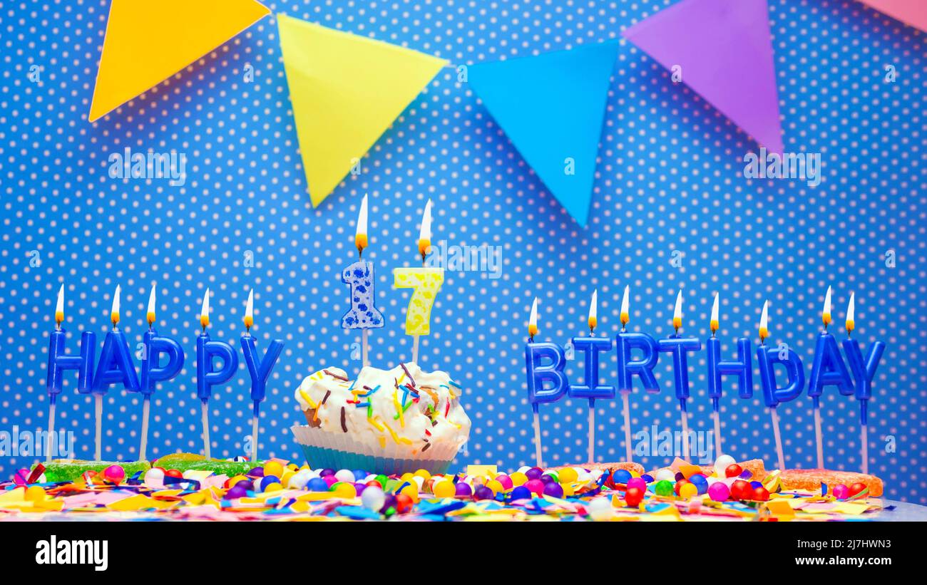 Happy birthday candle letters with a number or digit on a beautiful