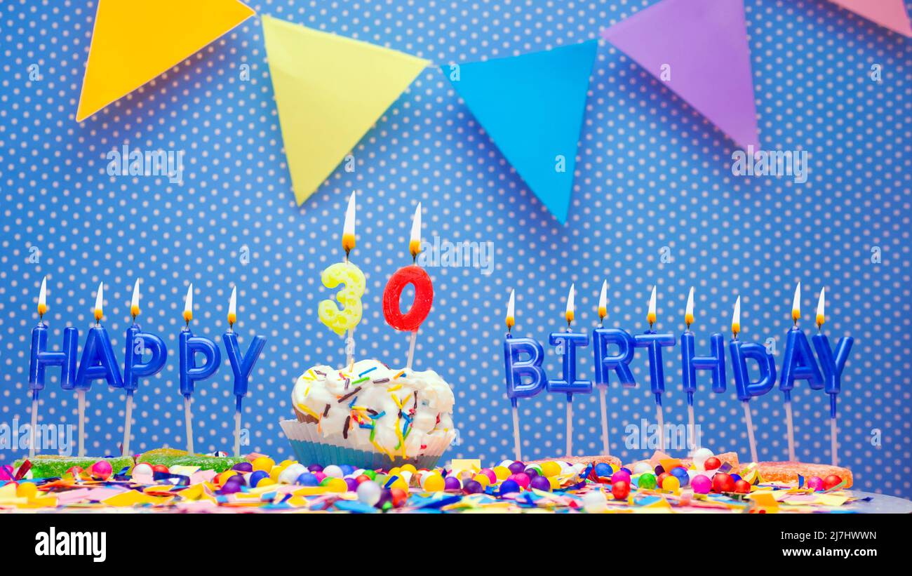 Happy birthday candle letters with a number or digit on a beautiful