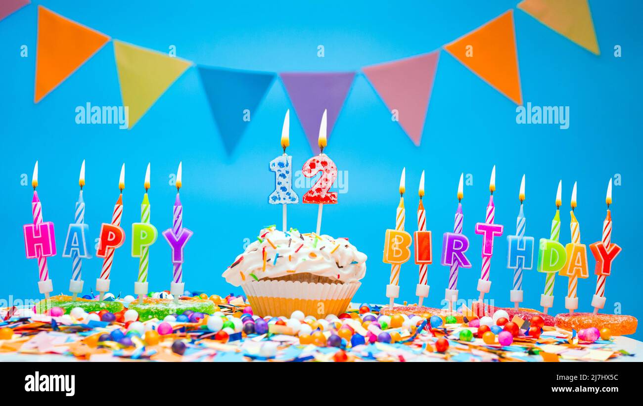 Happy birthday candle letters with a number or digit on a beautiful