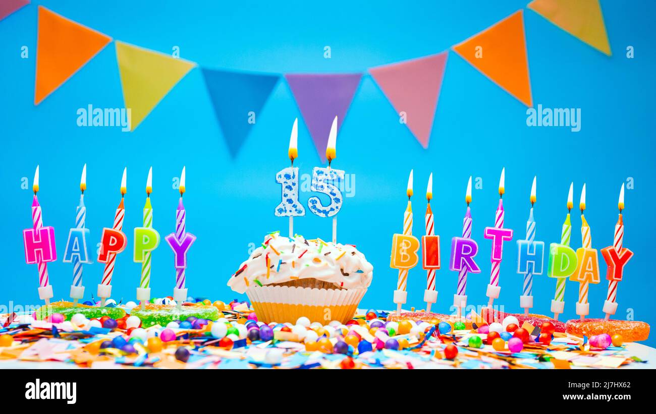 Happy birthday candle letters with a number or digit on a beautiful