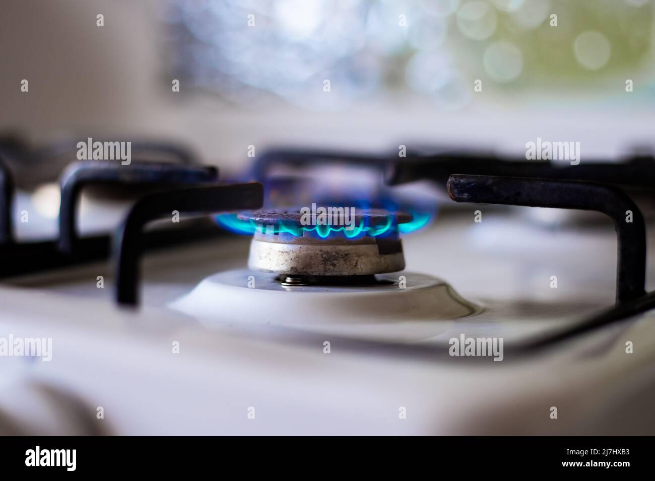 Gas burner with burning gas. Sale and purchase of gas fuel. Stock Photo