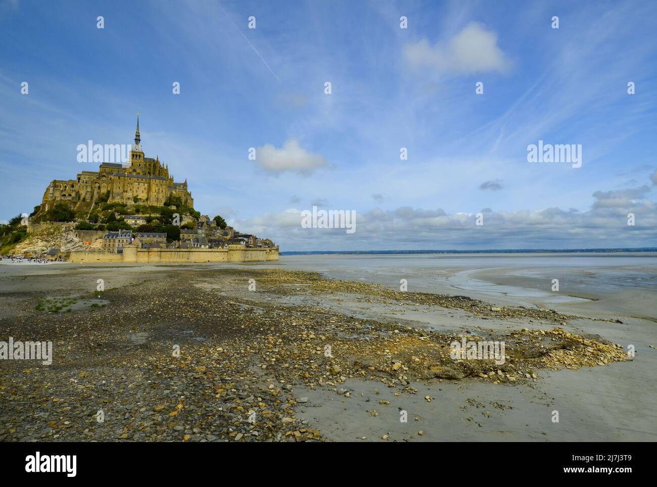 Mont-Saint-Michel in France, with historical buildings, walls, and a Church built on a tidal island. Layed buildings rise up 262 feet to Abby. Stock Photo