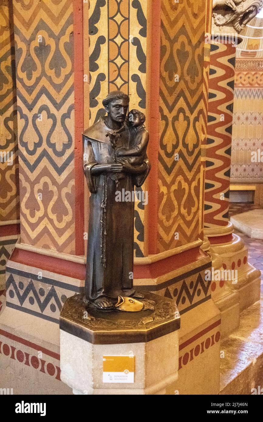 Monk with child statue. The Church of the Assumption of the Buda Castle ...